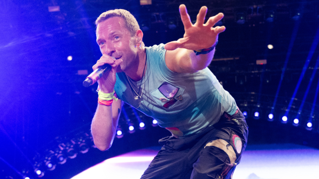 Chris Martin of Coldplay performs as the band headline the Pyramid stage during day four of Glastonbury Festival 2024 at Worthy Farm, Pilton on June 29, 2024 in Glastonbury, England.